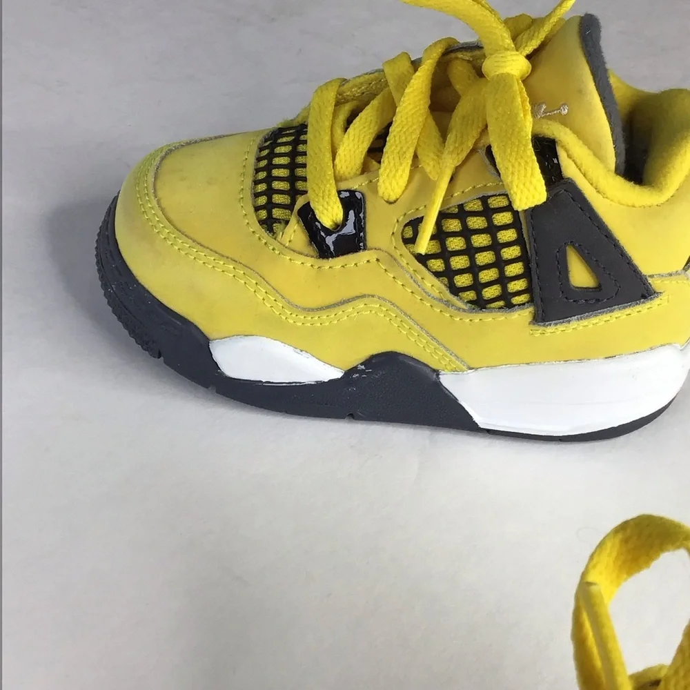 Nike Air Jordan 4 Retro TD Lightning Sneaker in Yellow Size 5.